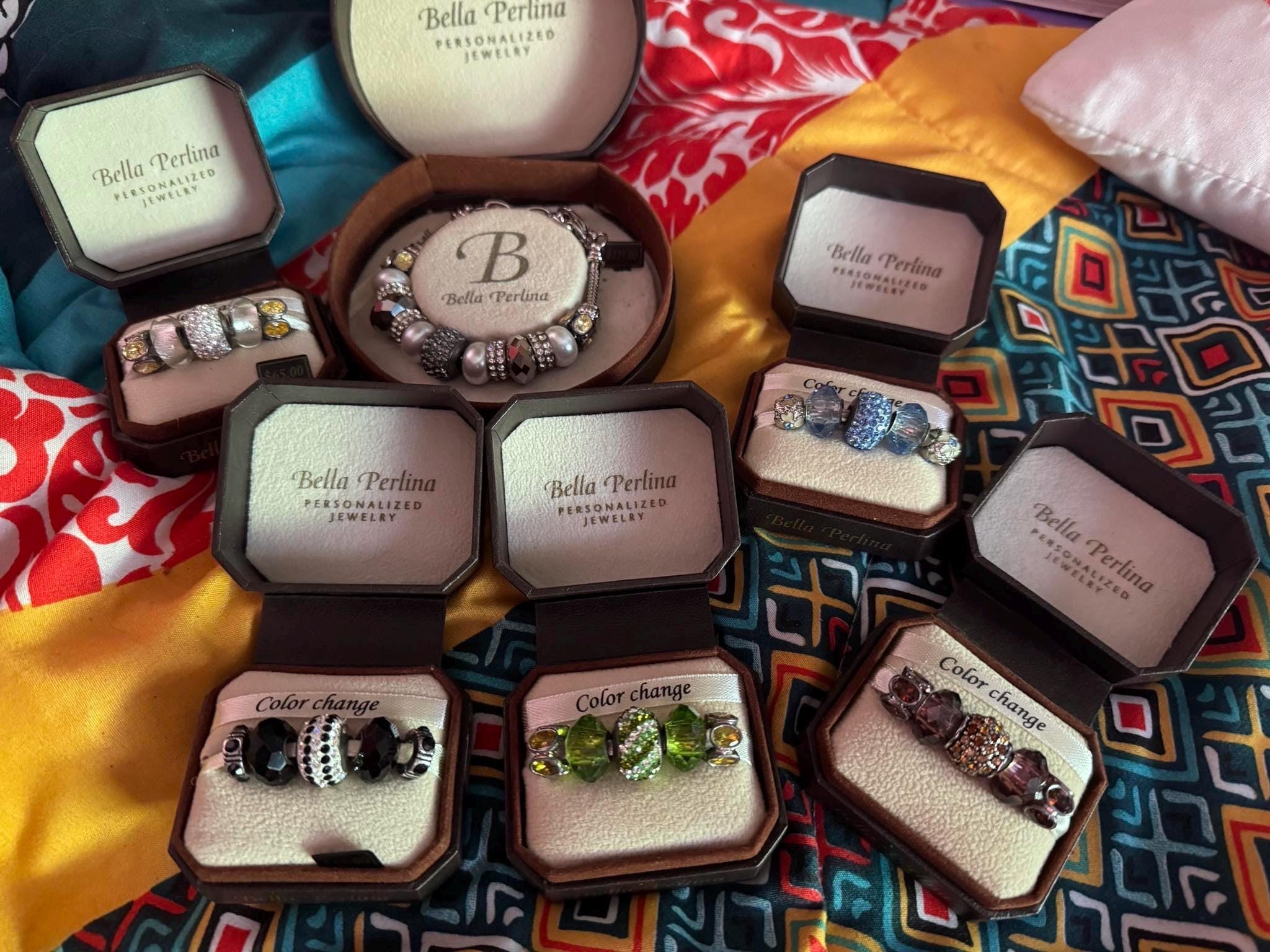 Bella Perlina Silver toned Charm Bracelet and sets of charms.