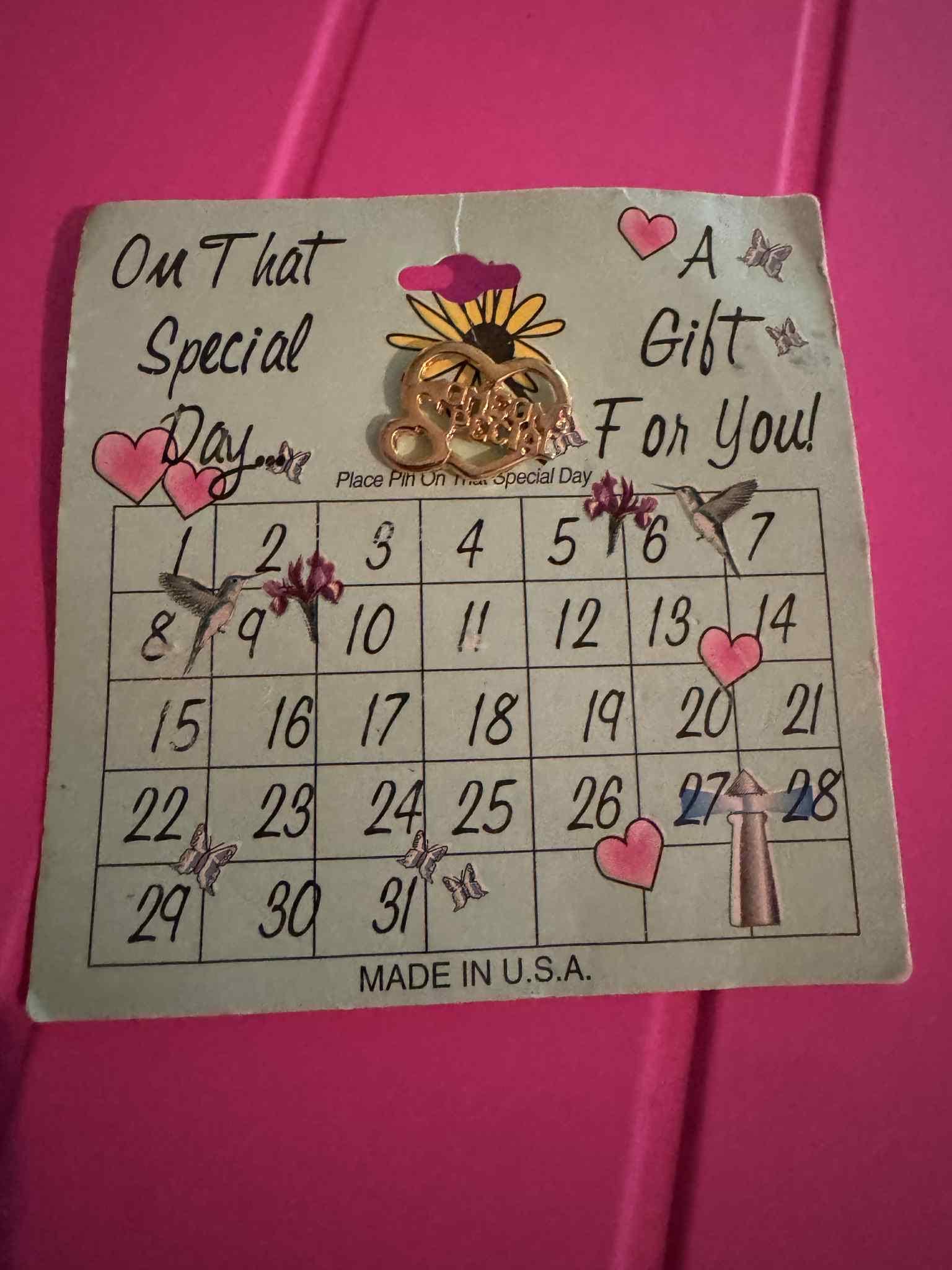 A “Someone Special “ gold toned Pin.