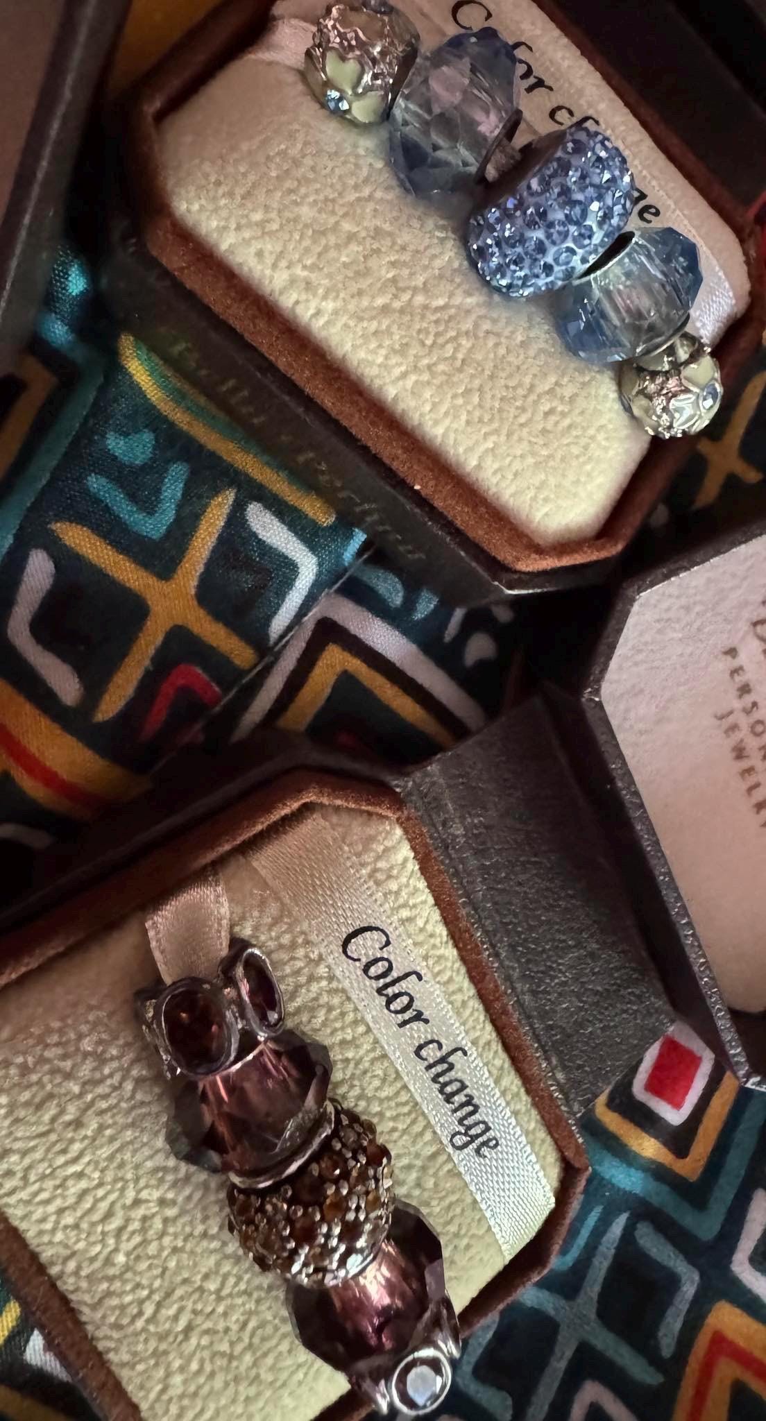 Bella Perlina Silver toned Charm Bracelet and sets of charms.