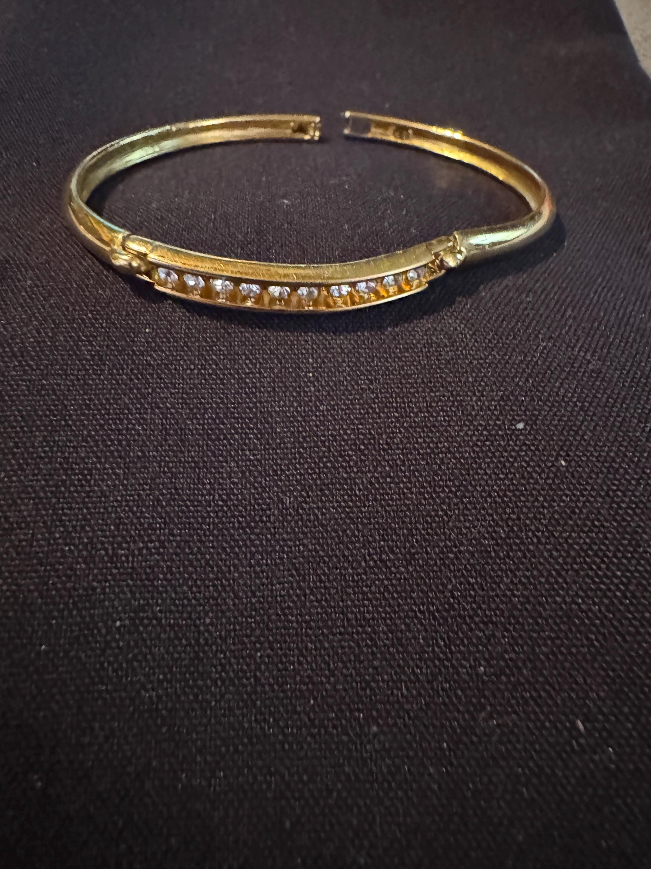 Beautiful Faux Half Tennis Bracelet, SP and hinged.