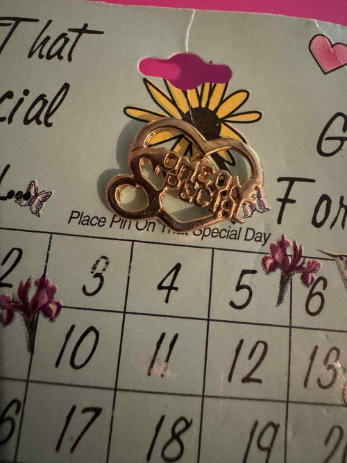 A “Someone Special “ gold toned Pin.