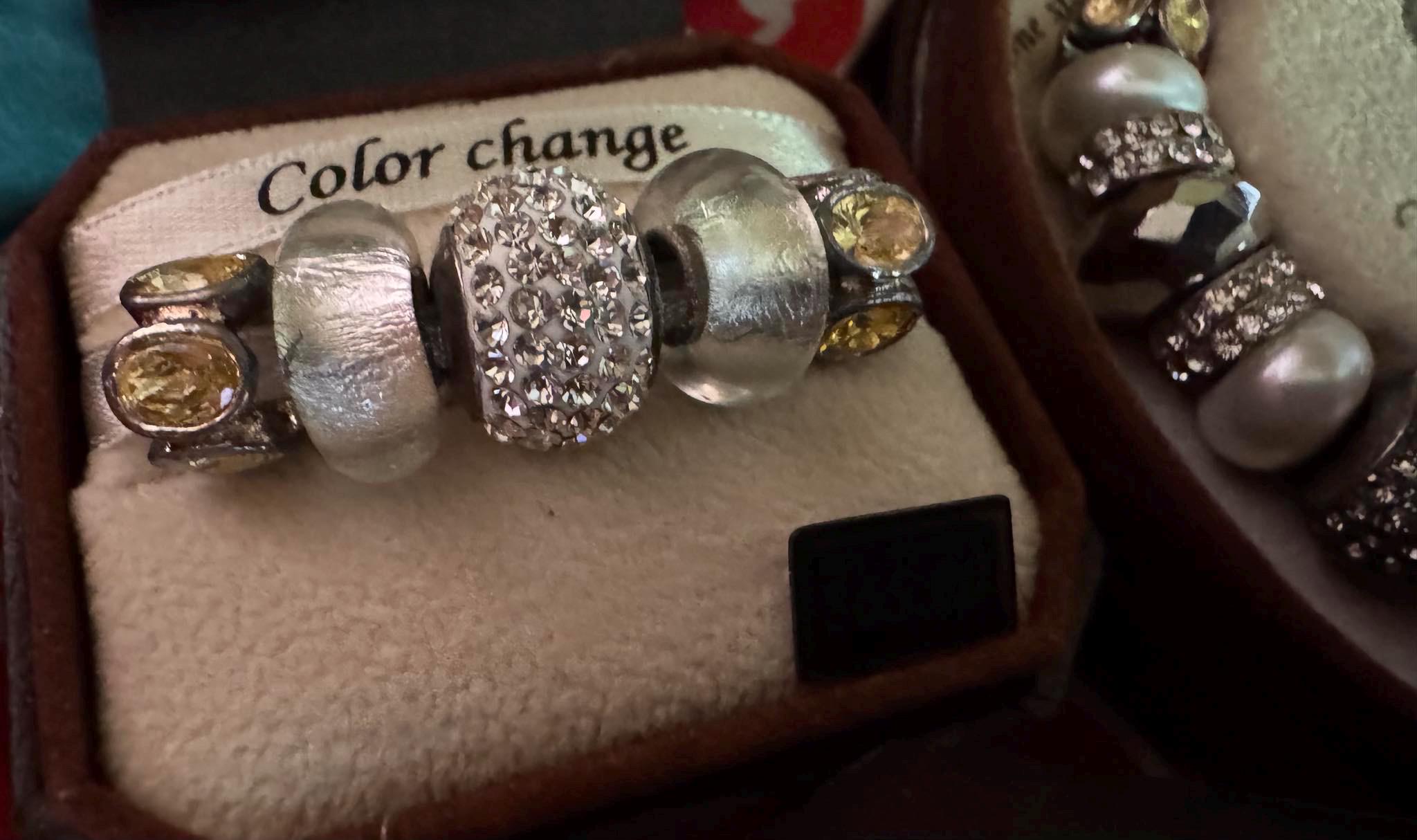 Bella Perlina Silver toned Charm Bracelet and sets of charms.