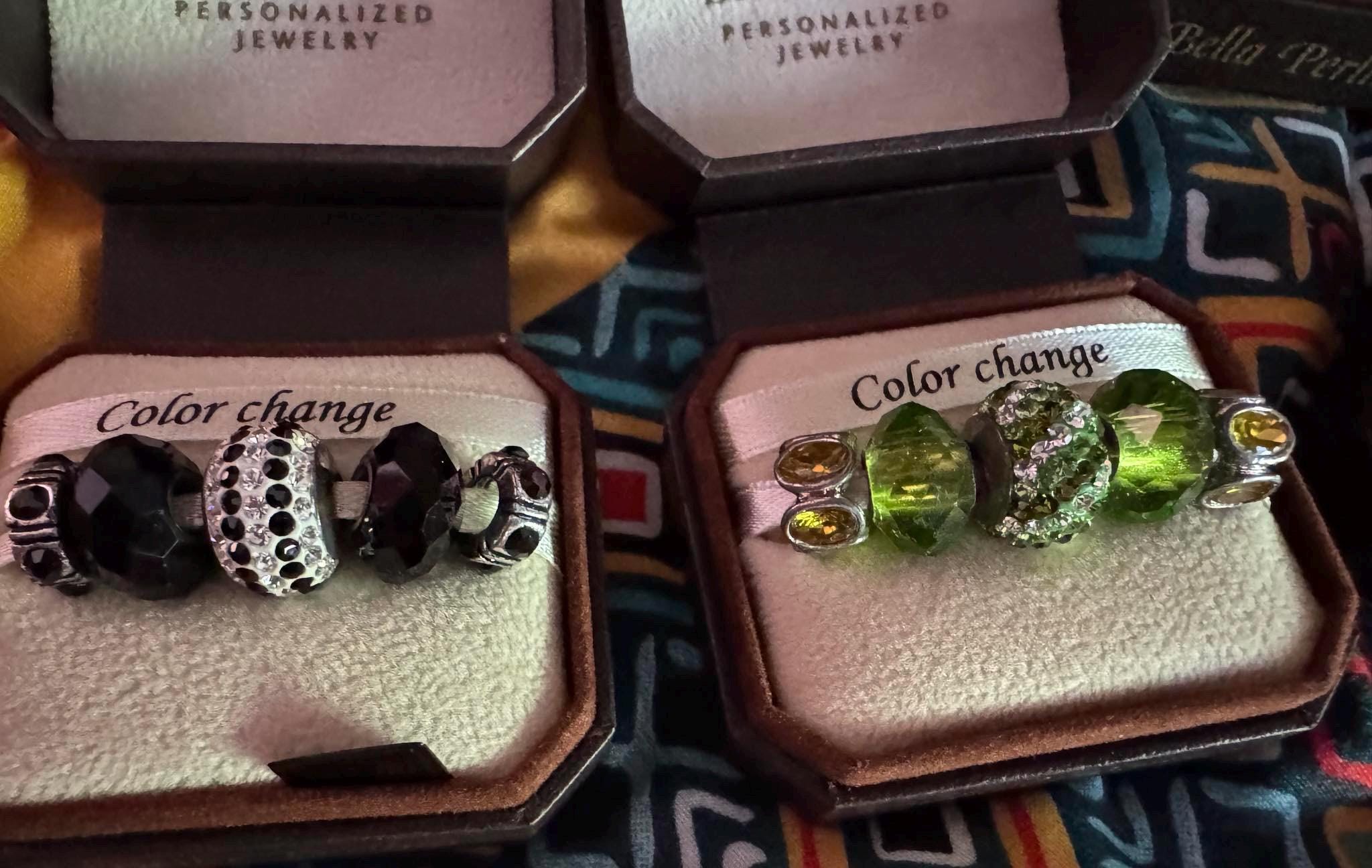 Bella Perlina Silver toned Charm Bracelet and sets of charms.